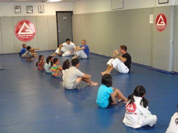 Gracie Barra instructors engage the children